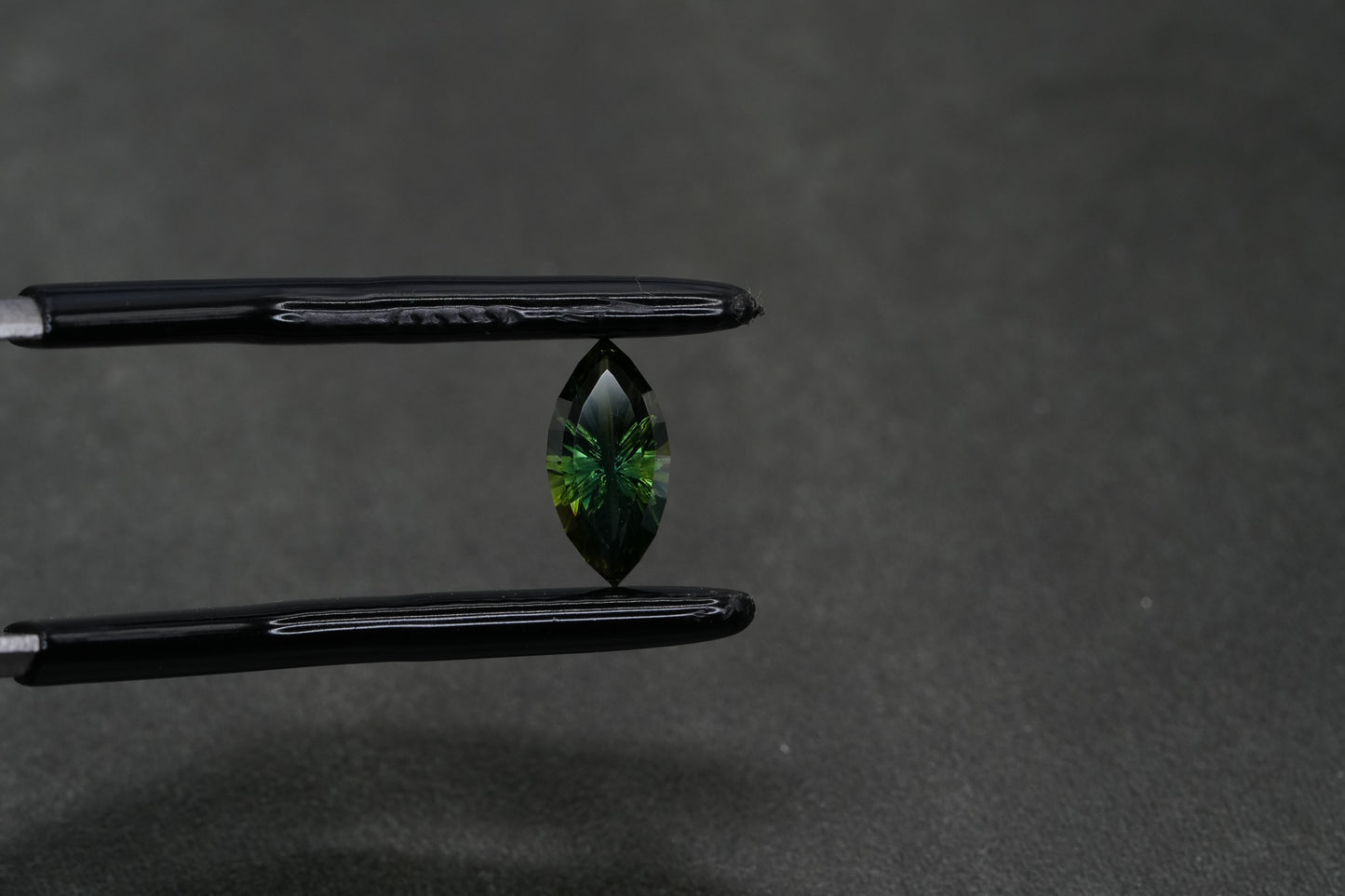 0.78 Carat Fantasy Cut Natural Dark Teal Sapphire