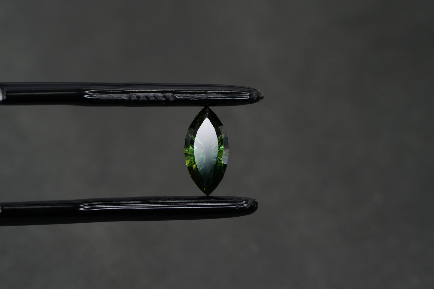 0.78 Carat Fantasy Cut Natural Dark Teal Sapphire